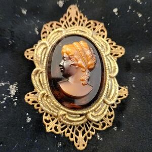 Vintage amber glass cameo brooch.